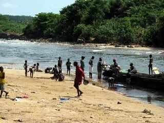 Kids playing near fishing boat